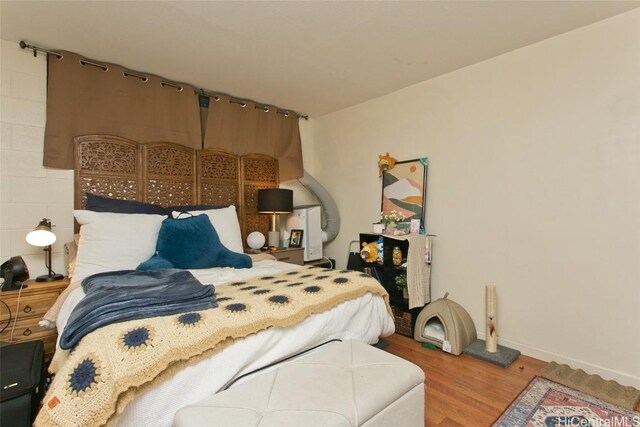 bedroom featuring hardwood / wood-style floors