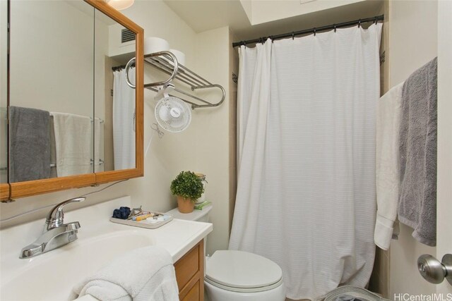 bathroom with vanity and toilet