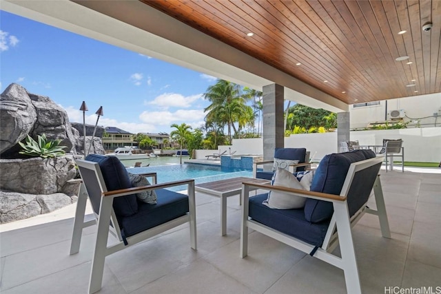 view of patio with pool water feature and a fenced in pool