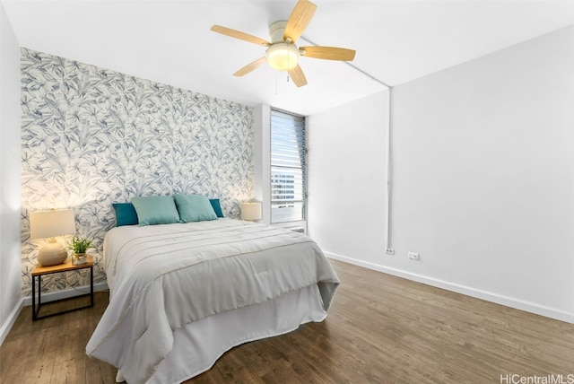 bedroom with wood-type flooring and ceiling fan