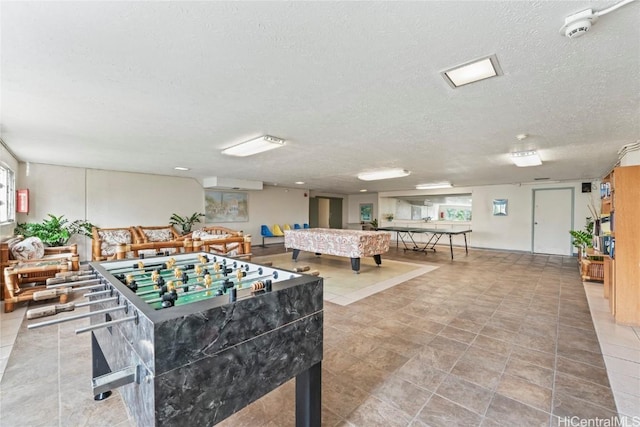 recreation room featuring a textured ceiling and billiards