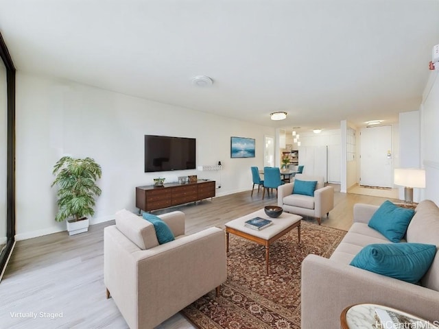 living room with light hardwood / wood-style flooring