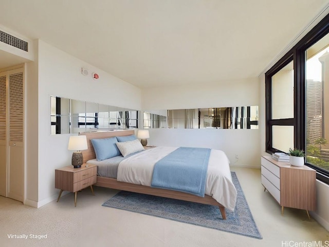 carpeted bedroom featuring a closet