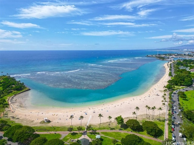 birds eye view of property with a water view and a view of the beach