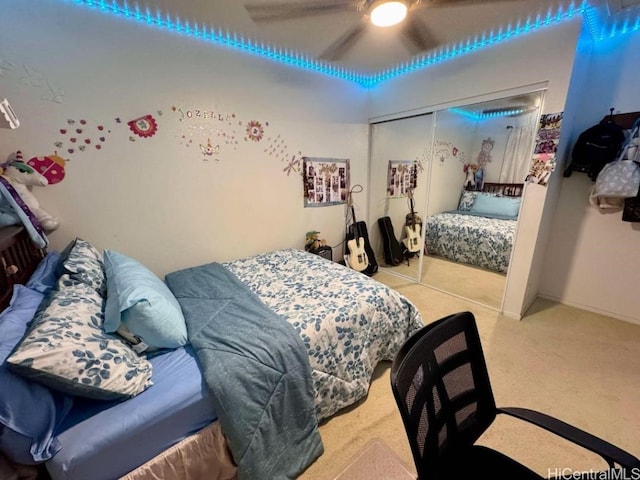 carpeted bedroom featuring a closet and ceiling fan