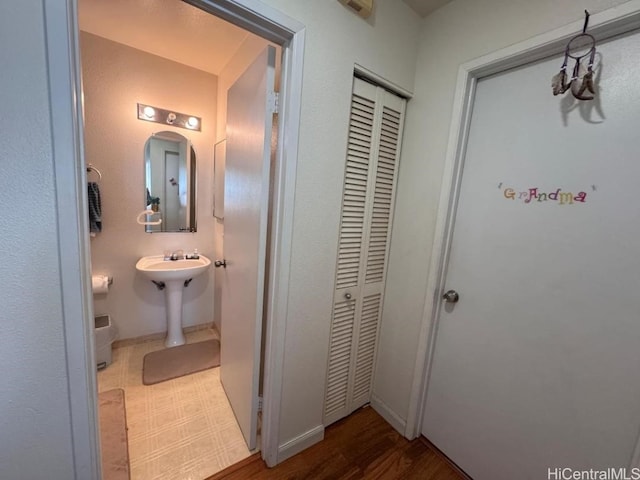 bathroom with hardwood / wood-style flooring