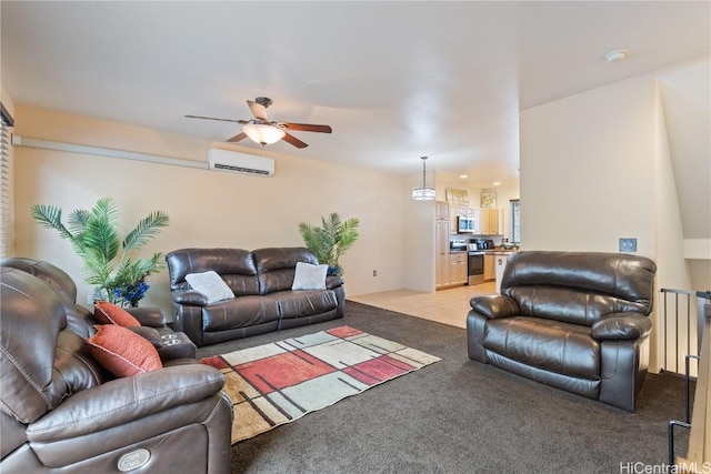 carpeted living room featuring an AC wall unit and ceiling fan