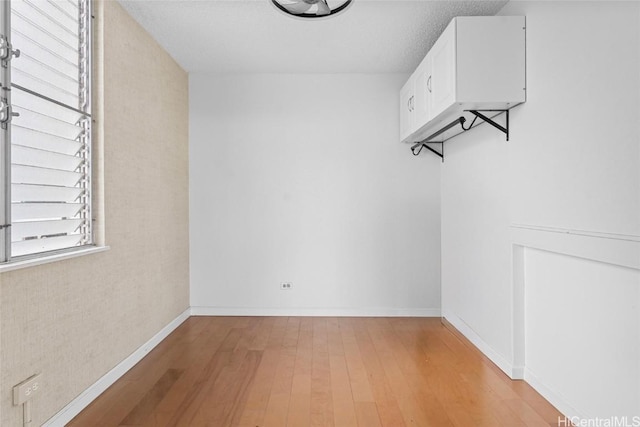 spacious closet with light hardwood / wood-style floors