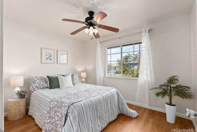 bedroom featuring ceiling fan and hardwood / wood-style flooring