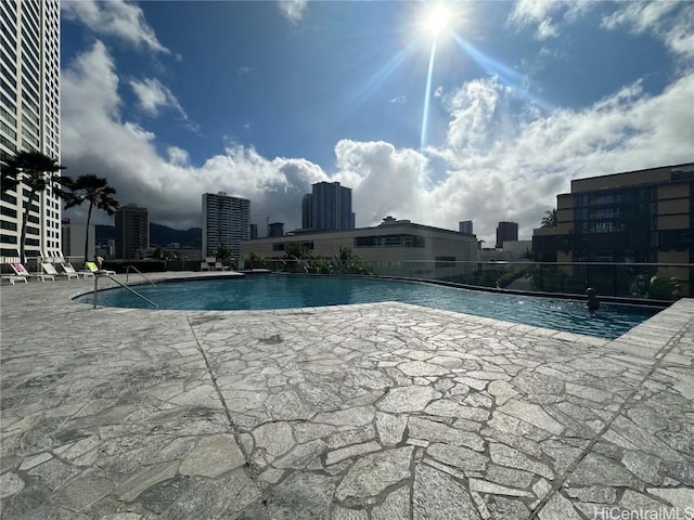 view of swimming pool featuring a patio