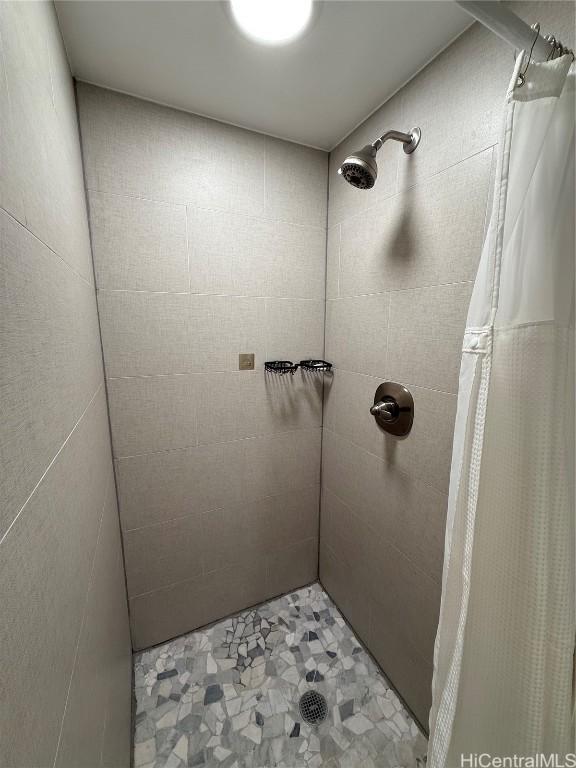 bathroom with a shower with shower curtain