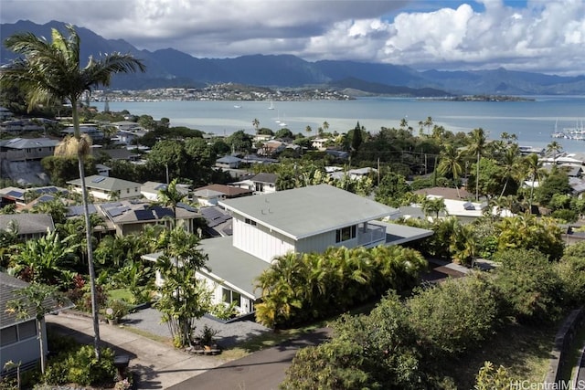 drone / aerial view featuring a water and mountain view