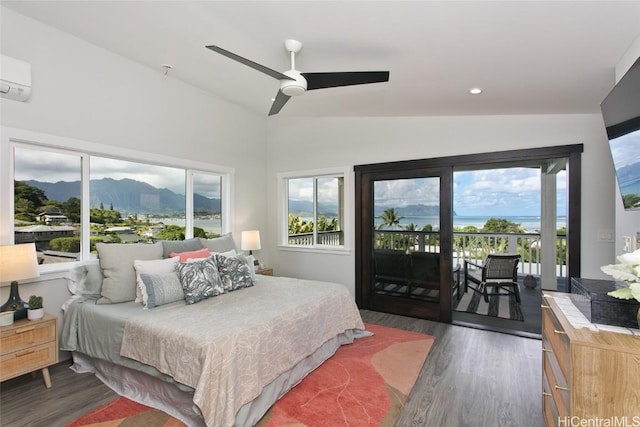 bedroom with a mountain view, multiple windows, access to outside, and vaulted ceiling