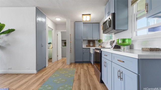 kitchen featuring stove and light hardwood / wood-style flooring