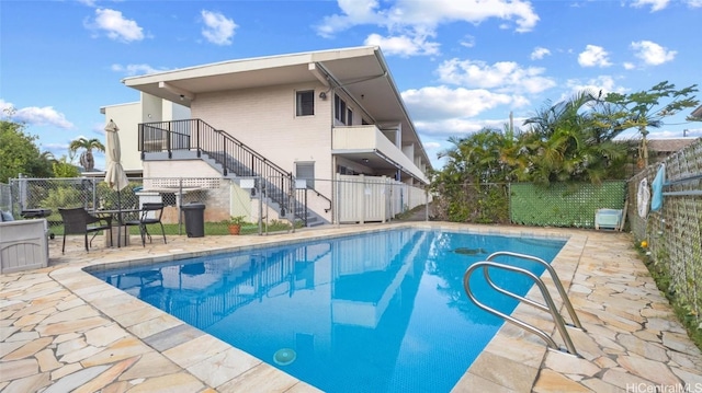 view of pool featuring a patio area