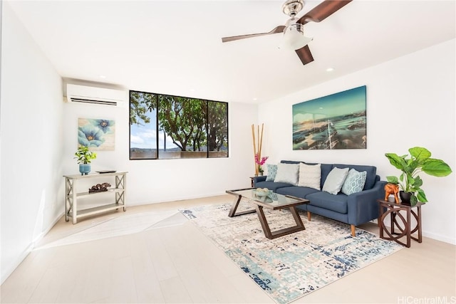 living room with light hardwood / wood-style floors, a wall unit AC, and ceiling fan