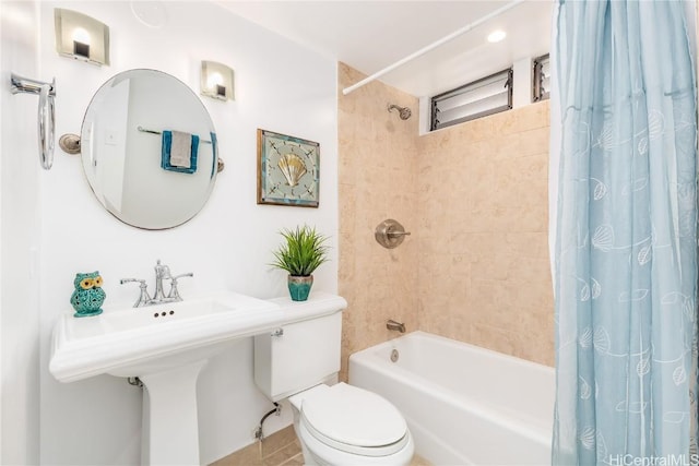 full bathroom with shower / bath combo, sink, and toilet