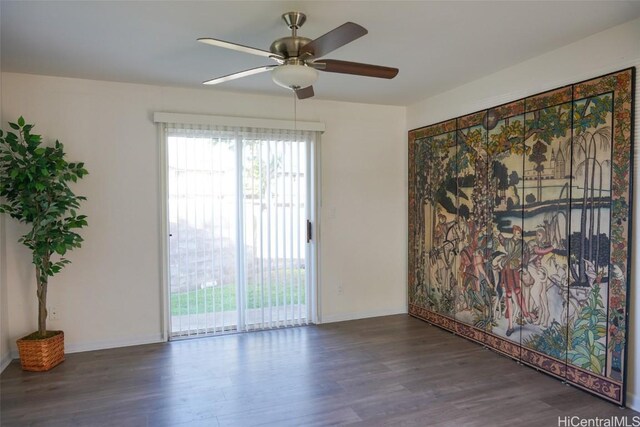 empty room with ceiling fan and dark hardwood / wood-style floors