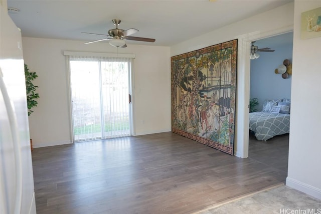 unfurnished room featuring wood-type flooring and ceiling fan