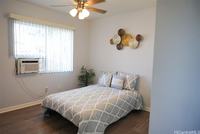 bedroom with ceiling fan, cooling unit, and dark hardwood / wood-style flooring