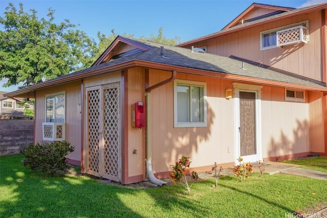 view of home's exterior with a lawn