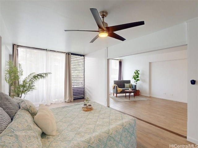 bedroom featuring wood-type flooring and ceiling fan