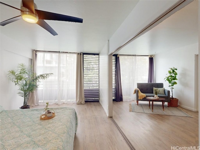 bedroom with ceiling fan and light hardwood / wood-style floors