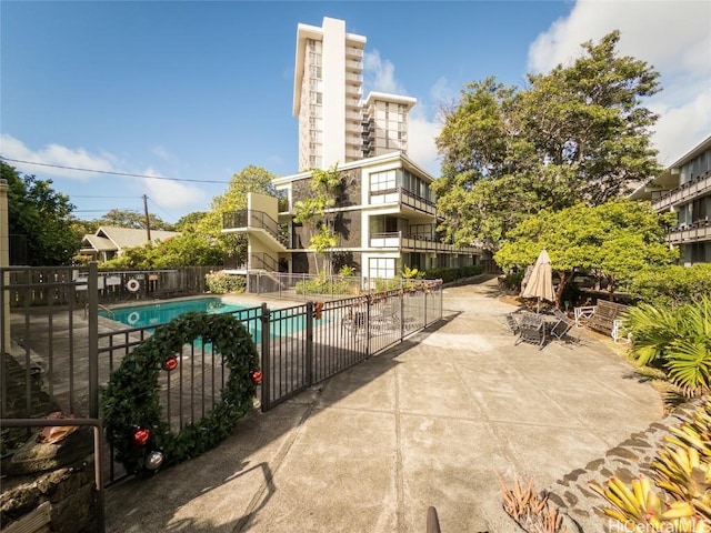 view of swimming pool with a patio area