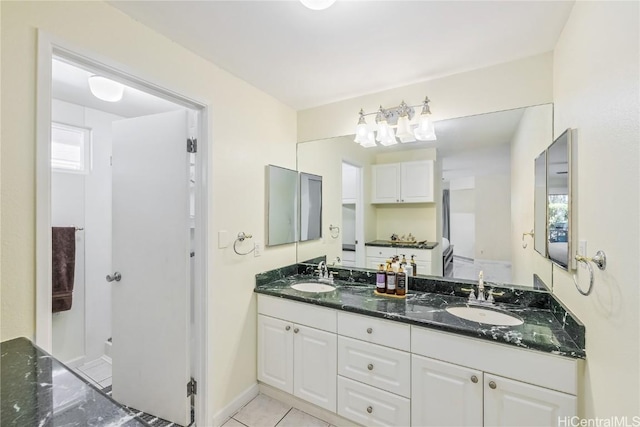 bathroom featuring vanity and tile patterned flooring