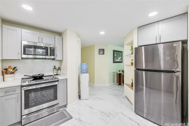 kitchen featuring gray cabinetry and stainless steel appliances