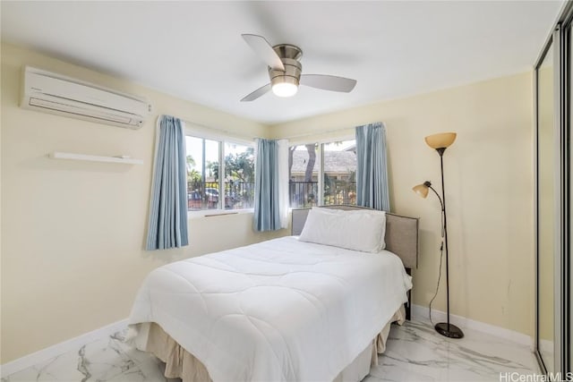 bedroom with ceiling fan and a wall unit AC