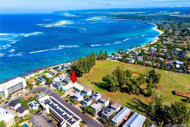 bird's eye view with a water view and a view of the beach