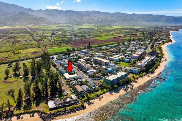 bird's eye view with a water and mountain view and a beach view