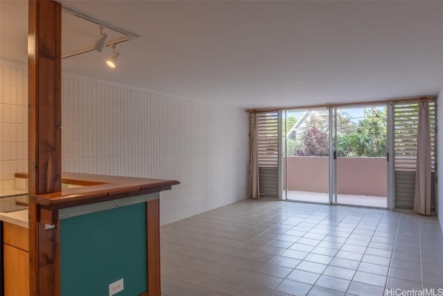 unfurnished room featuring light tile patterned floors