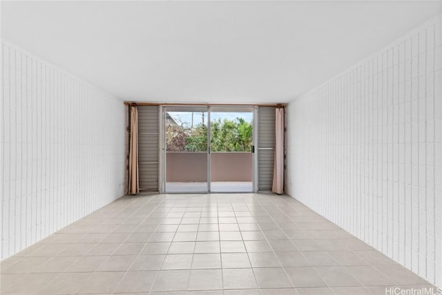 unfurnished room featuring light tile patterned floors