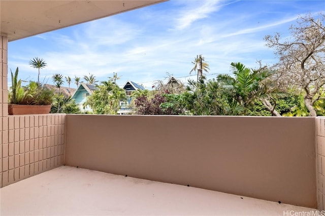 view of patio featuring a balcony