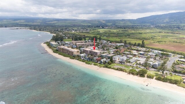 birds eye view of property featuring a view of the beach and a water view