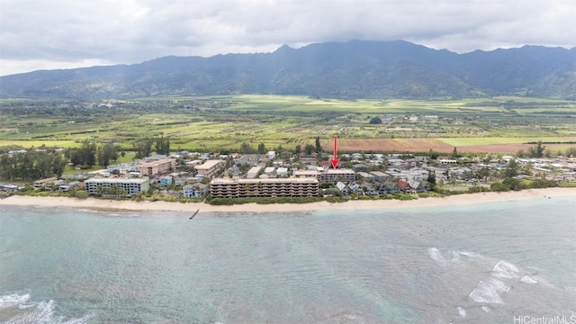 drone / aerial view with a water and mountain view