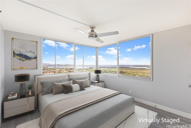 bedroom featuring dark wood-type flooring and ceiling fan