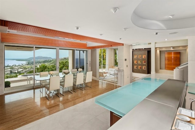 interior space with a mountain view and light tile patterned floors