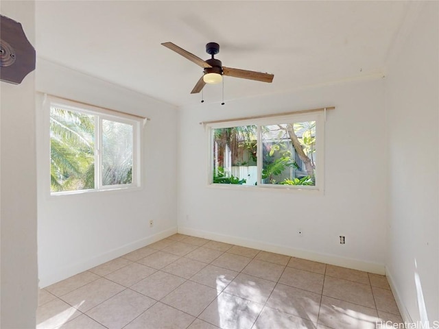 unfurnished room with ceiling fan and light tile patterned flooring