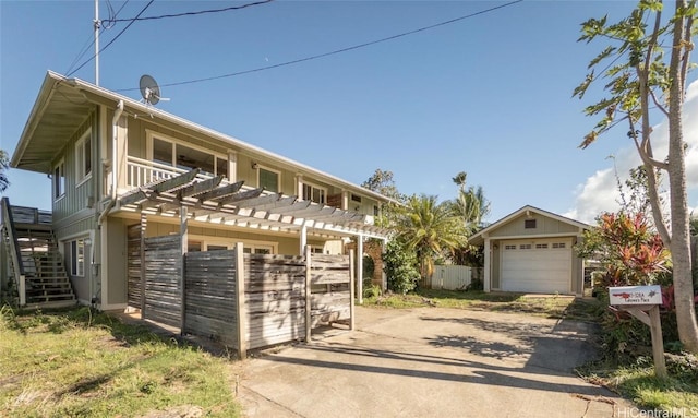 view of front of house with an outdoor structure and a garage