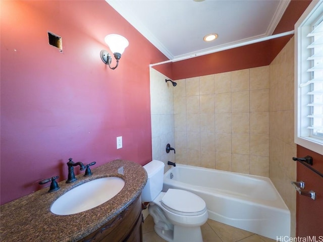 full bathroom with ornamental molding, tile patterned floors, toilet, vanity, and tiled shower / bath