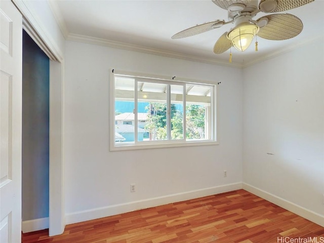 unfurnished room with ceiling fan, light hardwood / wood-style flooring, and ornamental molding