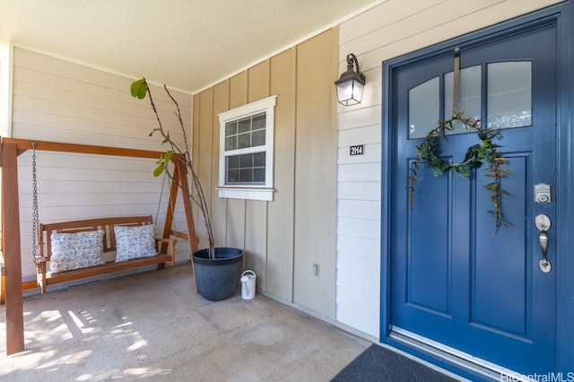 property entrance with covered porch