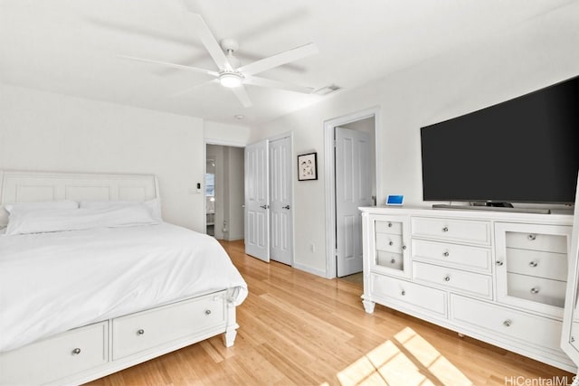 bedroom with ceiling fan and light hardwood / wood-style floors