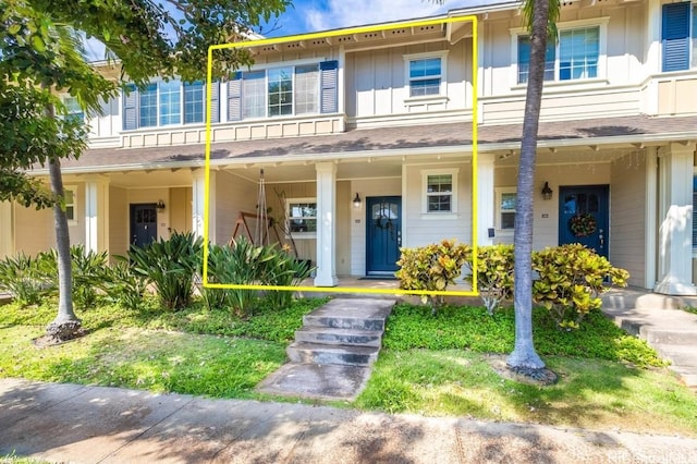 townhome / multi-family property with a porch