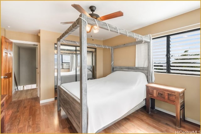 bedroom featuring wood-type flooring and ceiling fan