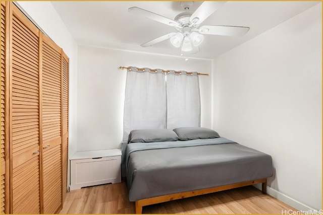 bedroom featuring a closet, ceiling fan, and light hardwood / wood-style floors