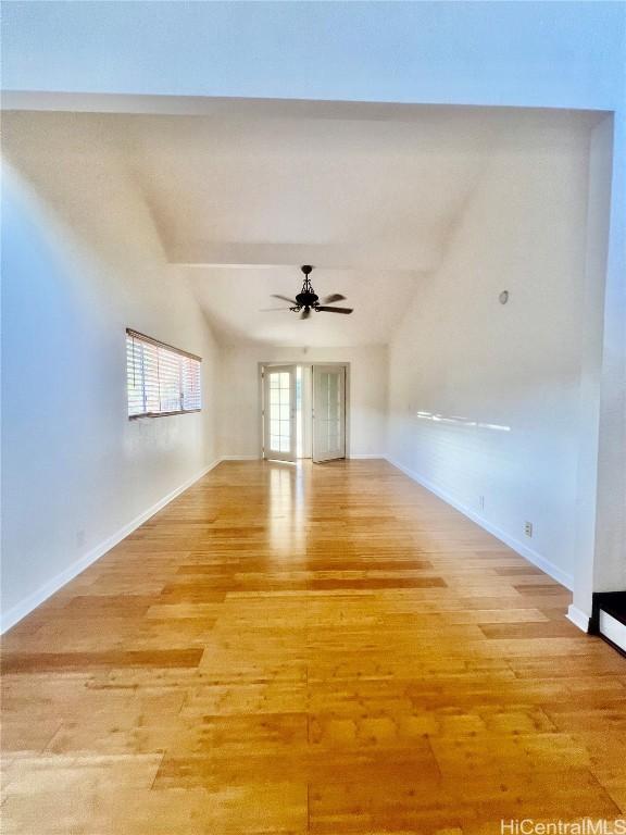 empty room featuring ceiling fan and light wood-type flooring